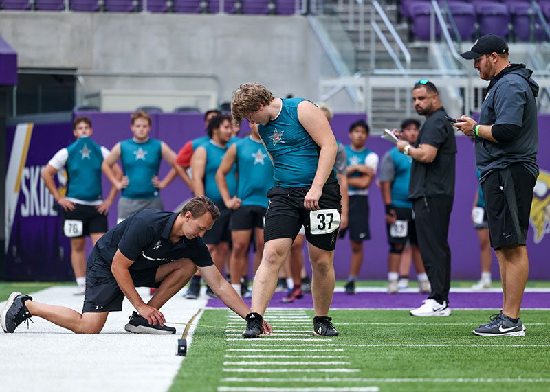 Coach taking measurement